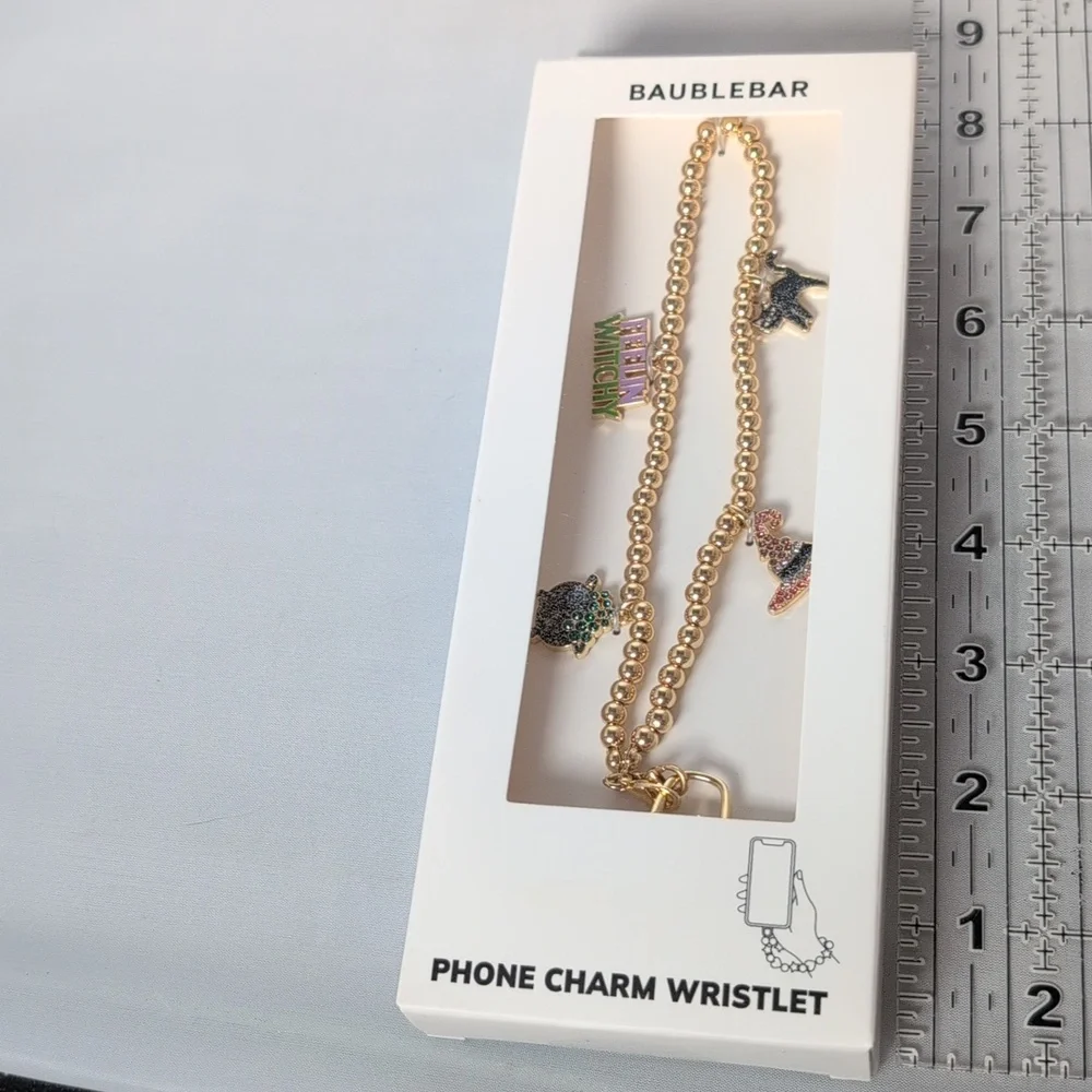 BaubleBar Halloween Themed Gold Tone Phone Charm Wristlet